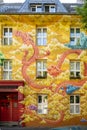 Graffiti, urban art in the city, abstract fantasy painting with dragon on house front in Dusseldorf, Germany